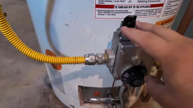 Gas water heater connections being installed and checked for Plumbing Tips and Guides