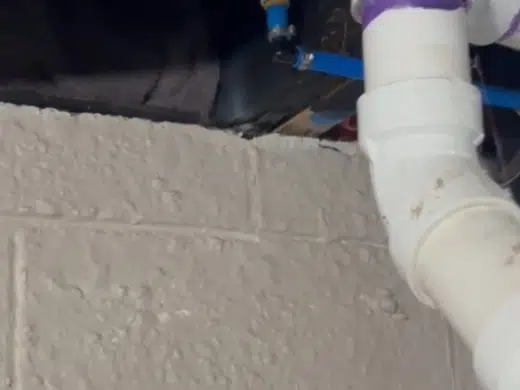Pipe repair area with insulation and cold-weather damage visible for Plumbing Services in Bellflower, CA