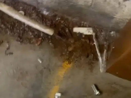 Underground water service line exposed near soil and landscaping for Plumbing Service Areas in Index.Html close repair view