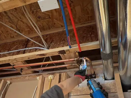 Utility sink drain and supply piping during installation for Plumbing Services in Bellflower, CA