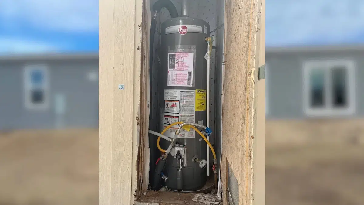 Water heater tank and connection area during inspection for Repair or Replace Your Water Heater? A Framework for Gateway Cities Homeowners